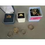 A selection of gold jewellery to include a 9ct gold ring, 9ct gold cased ladies wristwatch, ring set