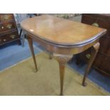 A mid 20th century burr walnut card table, with a foldover top on cabriole legs