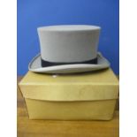 A Moss Brothers grey top hat with black band, size 7 1/2" and hat box