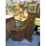 An early 20th century oak cased granddaughter longcase clock and a mahogany carved Art Nouveau