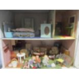 A late 20th century doll house 13 x 16 x10 with sliding front panel to include dolls house furniture