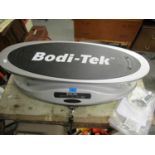 A Bodi-Tesk machine with DVD and power remote