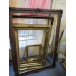 A quantity of large gilt frames, some early 20th century examples and others