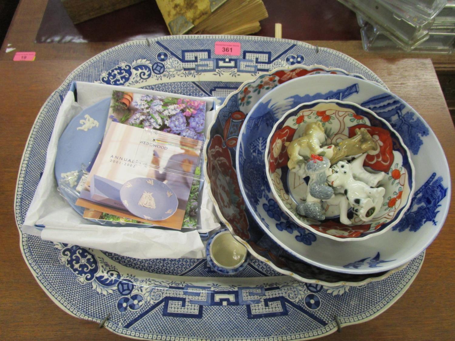 A selection of ceramics to include Japanese Imari bowls, Willow pattern meat plate, Wade TV pets