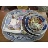 A selection of ceramics to include Japanese Imari bowls, Willow pattern meat plate, Wade TV pets