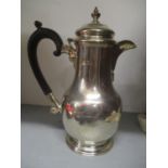 An early 20th century silver hot water pot