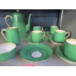 A T Good, Grosvenor china part coffee service having a green ground and gilt handles A/F