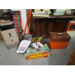 A mixed lot to include pogo sticks, an Aladdin style metal heater, vintage games, Roll Rider skates,