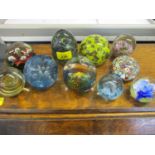 Mdina glass paperweights together with a Millefiori paperweight and others