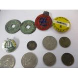 A small quantity of coins and badges