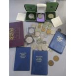 Mixed cased and loose coins to include cased Britain's first decimal coins, crowns and others