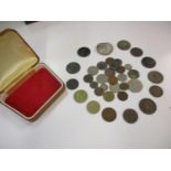 A small quantity of British and foreign coins to include silver coins