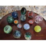 A group of glass paperweights to include Mdina, Irish Jerpoint and millefiori examples