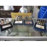 A collection of four United Kingdom proof coin sets from 2005, 2006, 2007 and 2008
