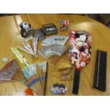 Japanese related collectables to include fans, an abacus, a face screen, a figure, gaming counters