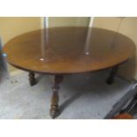 A Titchmarsh & Goodwin oak eight seater oval dining table, 30 1/4"h x 71 1/2"w