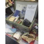 A selection of military related items to include letters, buttons, books, a signalling lamp and