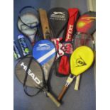 A selection of sports items to include a cricket bat, hockey stick and tennis related items