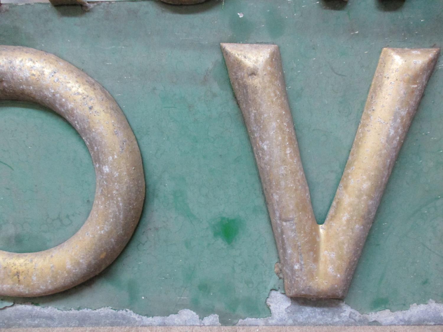 A late 19th/early 20th century gold and green painted metal Hovis Golden Brown bread sign in three - Image 6 of 9