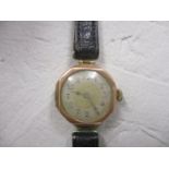 A 9ct gold ladies wristwatch on a leather strap