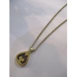 A 9ct gold pendant on a 9ct gold chain