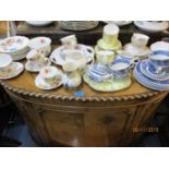 An Edwardian part teaset decorated with pansies, a Windsor part teaset and a Woods blue and white