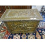 A mid 20th century brass coal chest with hinged top