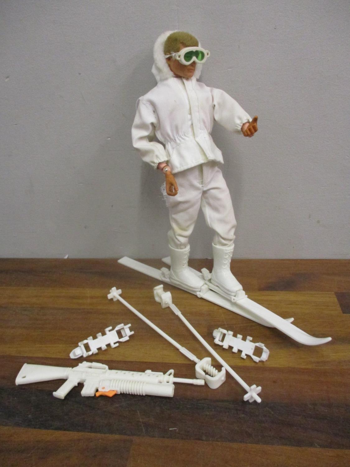 An Action Man dated 1964 in ski clothing with accessories