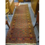 An orange ground runner with elephant gull design, 108x34"