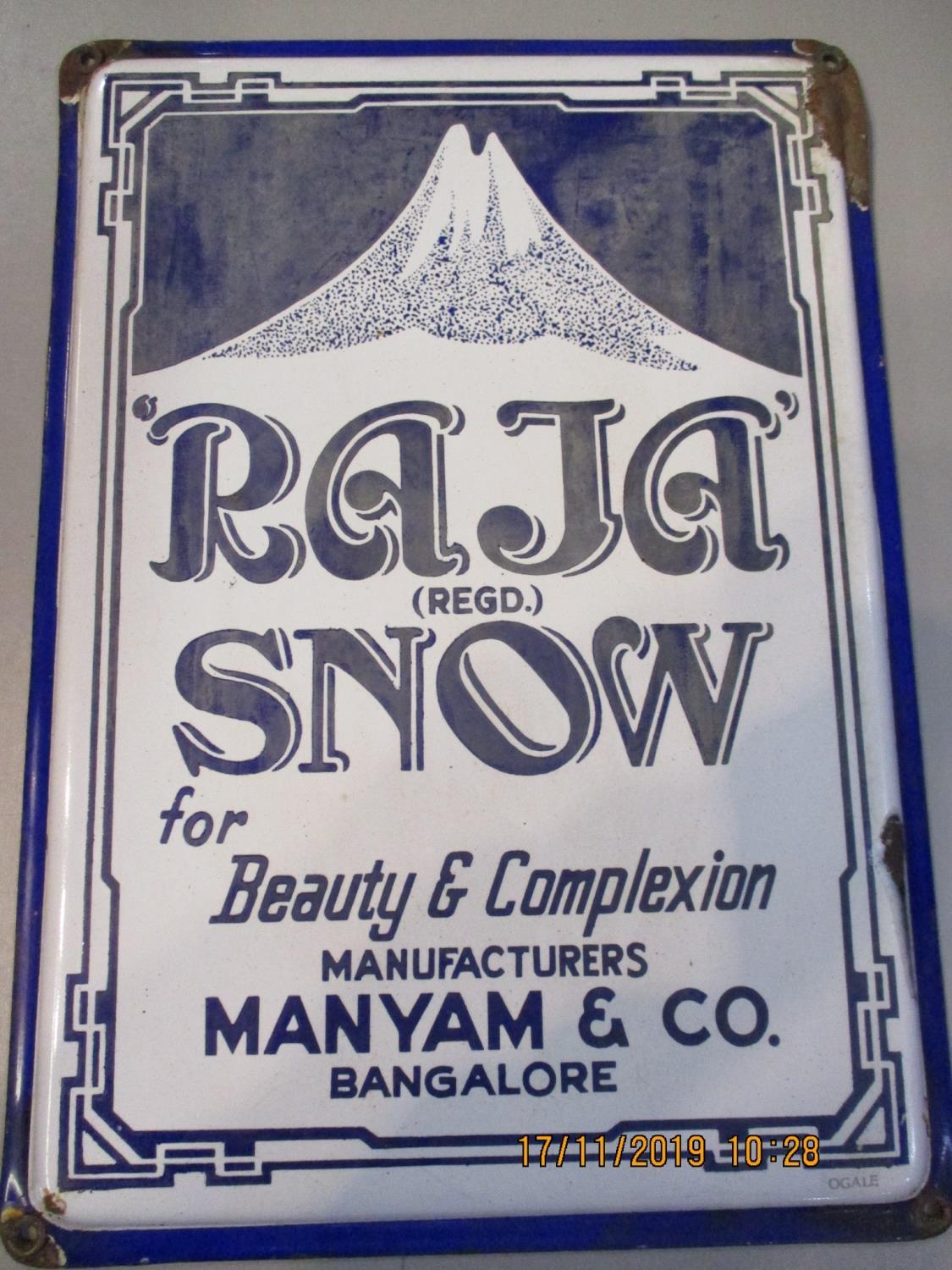 A vintage Raja Snow Talc enamelled sign in blue and white