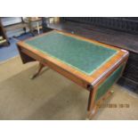 A reproduction sofa table with green scriber