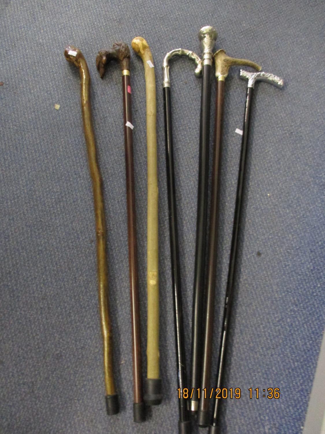 Seven walking canes, all reproductions to include a silver plated handle example and one with a - Image 2 of 2