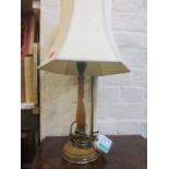 A turned mahogany table lamp