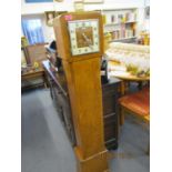 An Art Deco mixed veneered grandmother clock with a Westminster chime