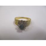 An 18ct gold aquamarine and diamond cluster ring, size M, 3.6g