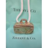 A silver Tiffany pill box in the form of a suitcase with box and bag