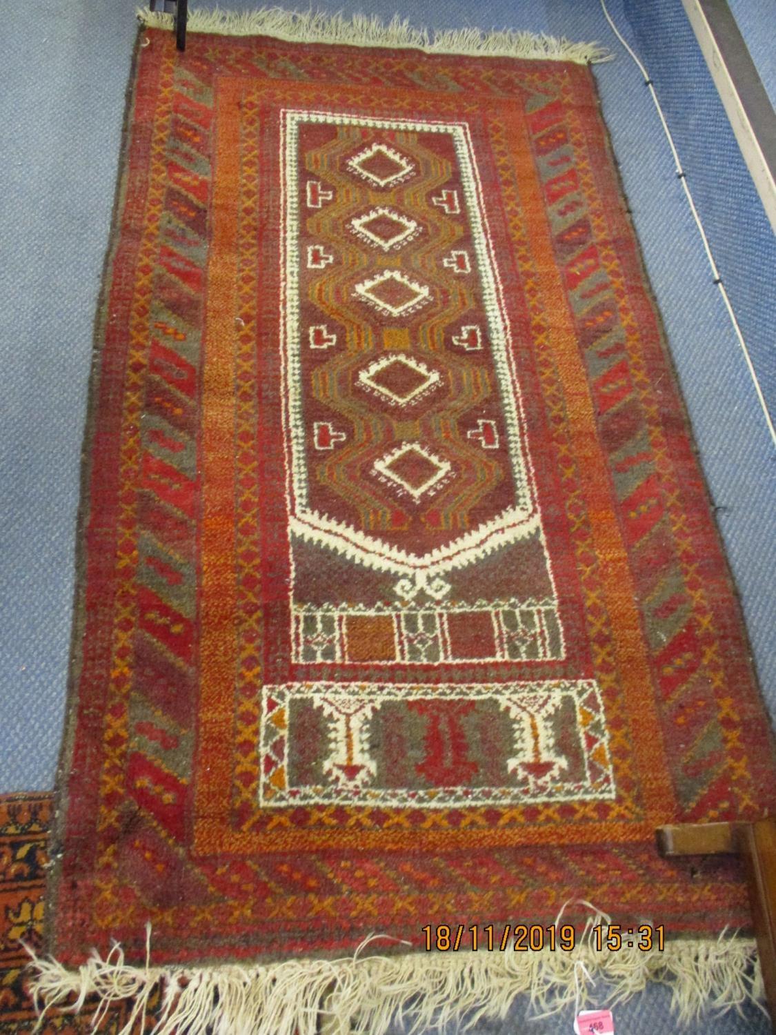 A Middle Eastern terracotta ground rug