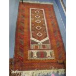 A Middle Eastern terracotta ground rug