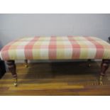 A modern mahogany double foot stool with chequered upholstery
