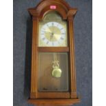 A reproduction mahogany cased London Clock Co wall clock
