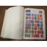 A world stamp album to include British, Chinese, Belgian and others