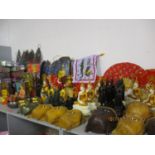 Painted treen plaques in the form of Buddha faces on drift wood, pedestal and mortas, painted boxes,
