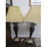 A pair of mottled black and silver painted table lamps A/F