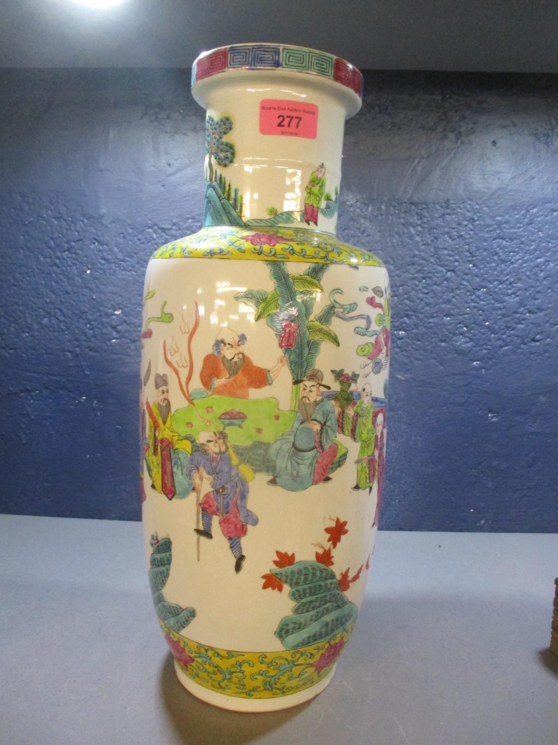 A 20th century Chinese vase decorated with figures on a white and yellow ground, 17" h