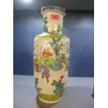 A 20th century Chinese vase decorated with figures on a white and yellow ground, 17" h