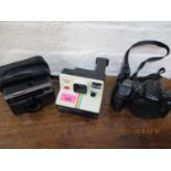 Late 20th century cameras to include, Minolta Dynax 500 si and a Polaroid land camera