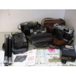 Vintage cameras to include an instant load Kodak, a Minolta Hi-Matic, together with a tripod and a