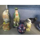 A small Moorcroft pot, a Beswick Magpie and Falcon and a Burslem Bill Sykes and his dog