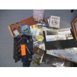Navy related items to include ephemera, DVDs, books, ties, a tin, a flag and a canon