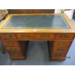 An early 20th century twin pedestal walnut desk